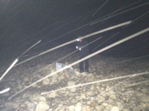 Cold fisherman braving snowfall while night fishing. (Not recommended)